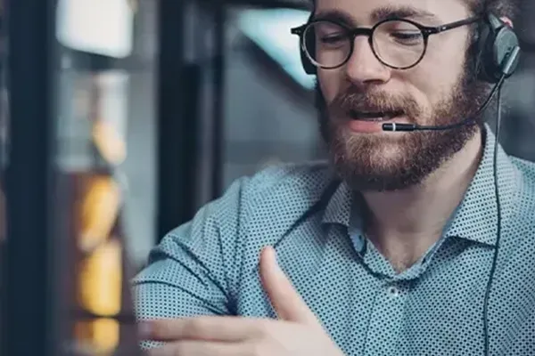 Man with glasses and headset on