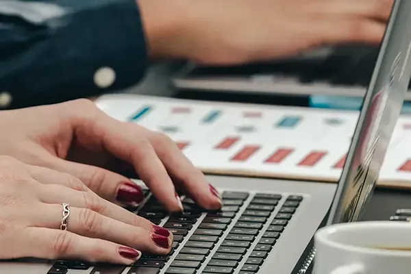 Woman typing on laptop