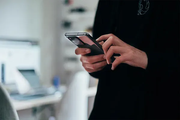 Person scrolling on mobile phone